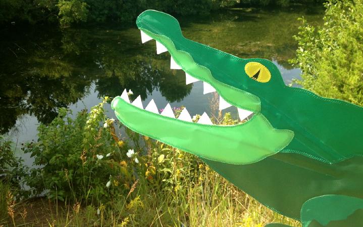 allie th alligator flag garden spinner whirligig from bald egle flag store fredericksburg va, from our collection of vintage flags, kites, windsocks, garden spinners and wind spinners, large alligator spinner rotates and spins in the wind