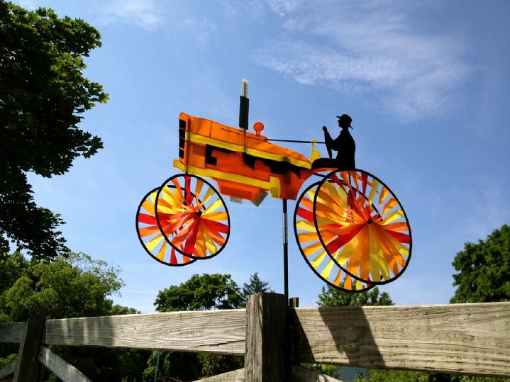 ORANGE TRACTOR GARDEN SPINNER BY BALD EAGLE FLAG STORE DIVISION OF BALD EAGLE INDUSTRIES SERVING FREDERICKSBURG, RICHMOND, HAMPTON, NEWPORT NEWS, NORFOLK, VA BEACH, ARLINGTON, ALEXANDRIA, FAIRFAX, STAFFORD, ASHLAND, MIDLOTHIAN, PETERSBURG, CHARLOTTESVILLE, CULPEPER, WARRENTON, MANASSAS, HAYMARKET, FRONT ROYAL, STRAUSBURG VA