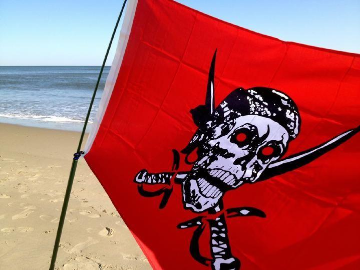 caribbean pirate flag from bald eagle flag store fredericksburg va, caribbean pirate flag and windsock pole flying on va beach by bald eagle flag store and bald eagle pirate flag shop