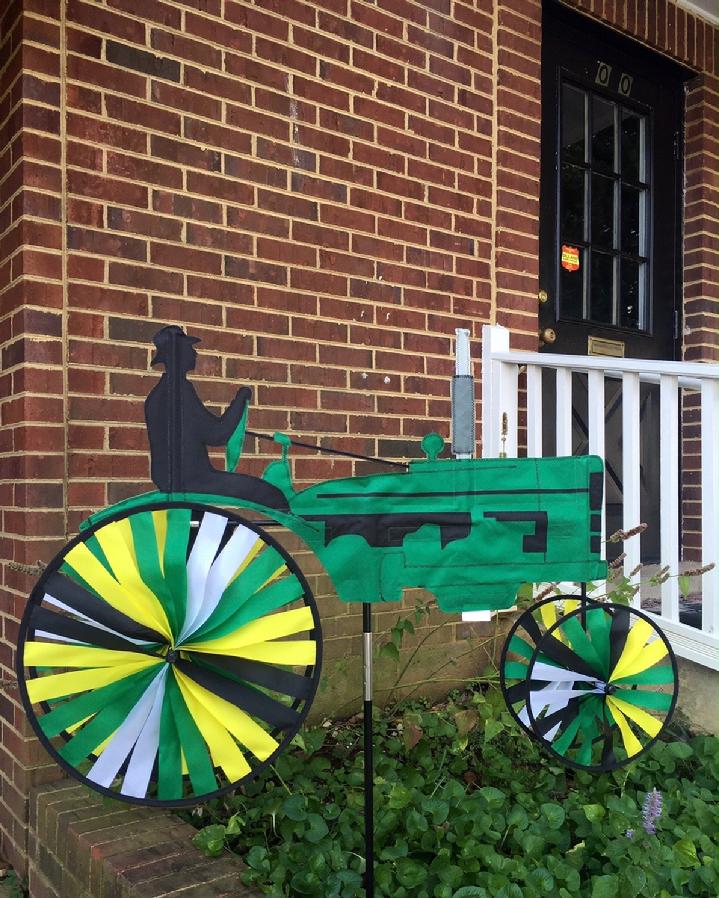 VINTAGE JOHN DEERE TRACTOR SPINNER BY BALD EAGLE FLAG STORE 540-374-3480 SOLARMAX NYLON GREEN TRACTOR WITH YELLOW, GREEN, WHITE AND BLACK WHEELS PRODUCED IN 2004, NEW IN ORIGINAL PACKAGES, BALD EAGLE FLAG STORE FREDERICKSBURG VA 540-374-3480 PHOTOGRAPH BY BALDEAGLEINDUSTRIES.COM