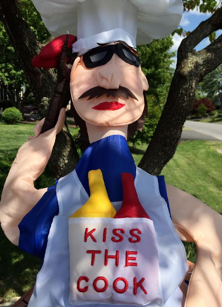 GRILLIN GARY WINDSOCK VINTAGE WINDSOCK KISS THE COOK WINDSOCK BY BALD EAGLE FLAG STORE, (540) 374-3480 PHOTOGRAPH BY BALDEAGLEINDUSTRIES.COM