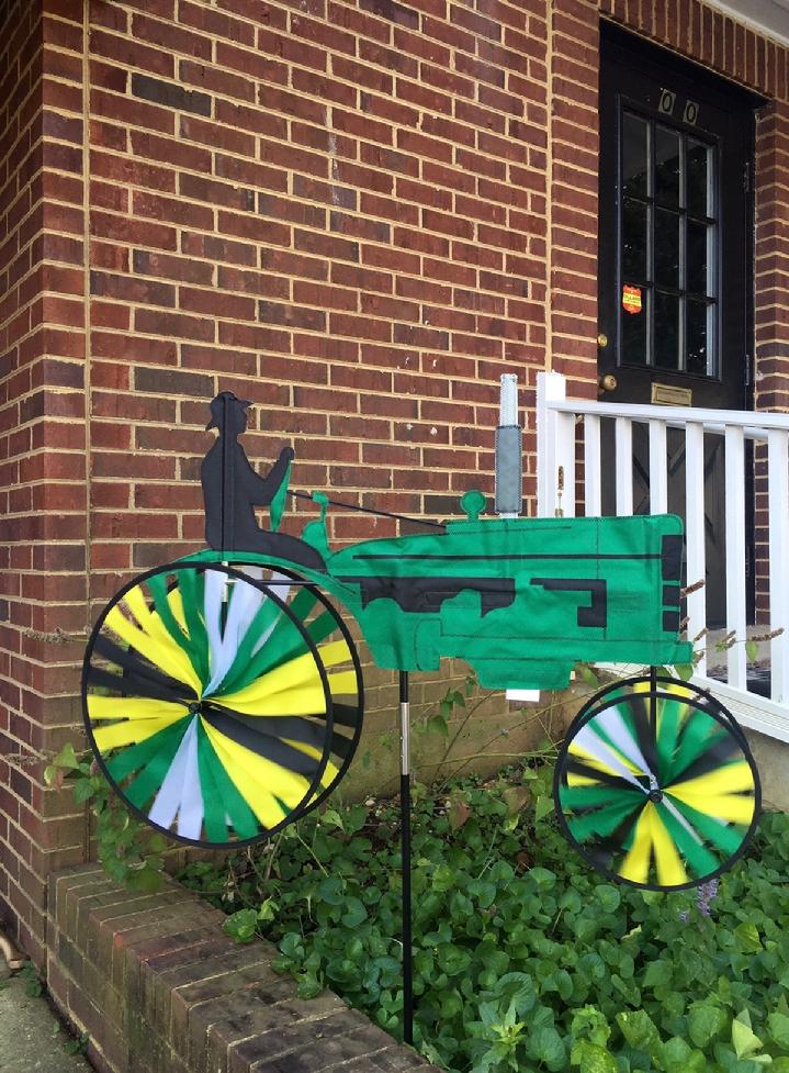 VINTAGE JOHN DEERE TRACTOR SPINNER BY BALD EAGLE FLAG STORE 540-374-3480 SOLARMAX NYLON GREEN TRACTOR WITH YELLOW, GREEN, WHITE AND BLACK WHEELS PRODUCED IN 2004, NEW IN ORIGINAL PACKAGES, BALD EAGLE FLAG STORE FREDERICKSBURG VA 540-374-3480 PHOTOGRAPH BY BALDEAGLEINDUSTRIES.COM